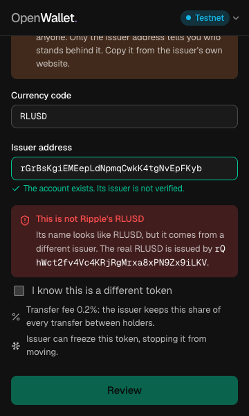 Adding a token named RLUSD from a different issuer: a red warning says this is not Ripple's RLUSD and gives the real issuer address.